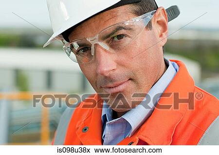 Engineer wearing safety goggles View Large Photo Image Stock Photo - Engineer wearing safety goggles. Fotosearch
