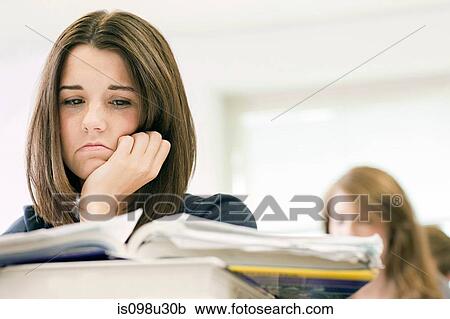 Stock Image - Anxious female high school student. Fotosearch