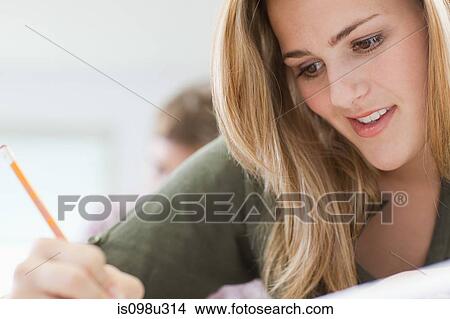 Female high school student working in classroom View Large Photo Image Picture - Female high school student working in classroom. Fotosearch