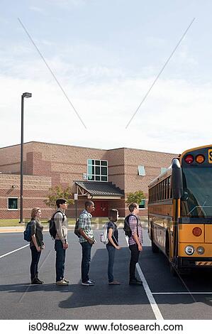 High school students queuing for school bus View Large Photo Image Stock Photo - High school students queuing for school bus. Fotosearch