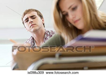Stock Photo - Male high school student copying classmate's work. Fotosearch