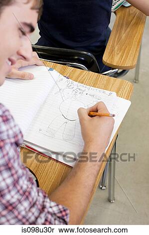 Male high school student doodling in notebook View Large Photo Image Stock Photography - Male high school student doodling in notebook. Fotosearch