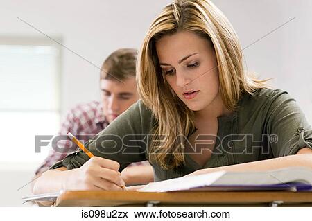 Studious female high school student View Large Photo Image Stock Photo - Studious female high school student. Fotosearch