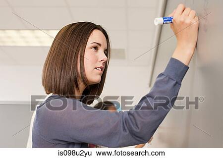 Female high school student writing on white board View Large Photo Image Stock Photograph - Female high school student writing on white board. Fotosearch