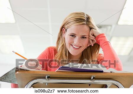 High school student sitting in classroom View Large Photo Image Stock Photo - High school student sitting in classroom. Fotosearch