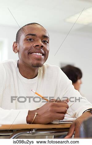 High school student sitting in classroom View Large Photo Image Stock Photograph - High school student sitting in classroom. Fotosearch