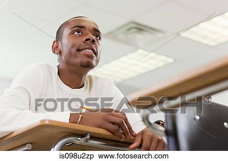 Stock Photography - High school student sitting in classroom. Fotosearch