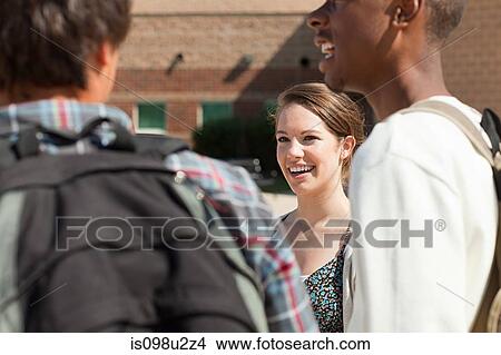 High school students outside school building View Large Photo Image Picture - High school students outside school building. Fotosearch