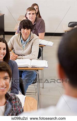 Male high school teacher and students in classroom View Large Photo Image Stock Image - Male high school teacher and students in classroom. Fotosearch