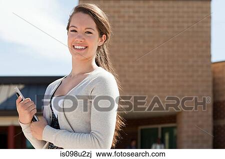 Stock Image - Portrait of female high school student. Fotosearch