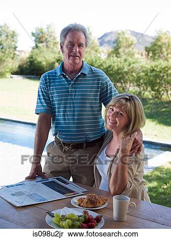 Couple outdoors with breakfast View Large Photo Image Stock Photography - Couple outdoors with breakfast. Fotosearch