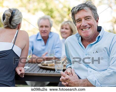 Man at meal outdoors View Large Photo Image Stock Photograph - Man at meal outdoors. Fotosearch