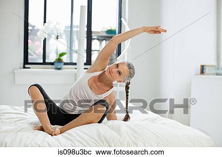 Mature woman practicing yoga View Large Photo Image Stock Image - Mature woman practicing yoga. Fotosearch