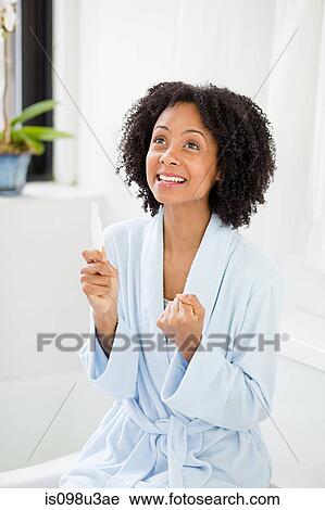 Woman overjoyed at pregnancy test result View Large Photo Image Stock Image - Woman overjoyed at pregnancy test result. Fotosearch