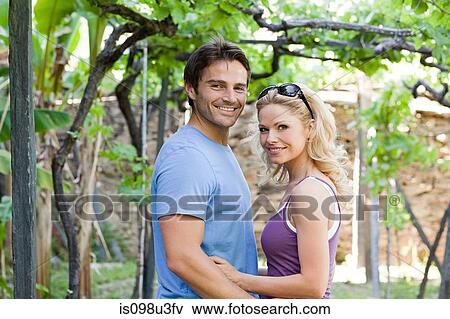 Couple in a vineyard View Large Photo Image Stock Photo - Couple in a vineyard. Fotosearch