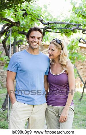 Couple in a vineyard View Large Photo Image Stock Photo - Couple in a vineyard. Fotosearch