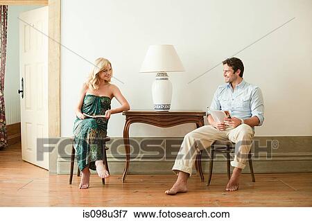Stock Photo - Couple in hotel room. Fotosearch