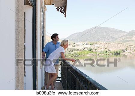 Couple on balcony overlooking douro river View Large Photo Image Picture - Couple on balcony overlooking douro river. Fotosearch