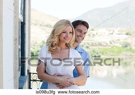 Couple on balcony overlooking douro river View Large Photo Image Stock Image - Couple on balcony overlooking douro river. Fotosearch