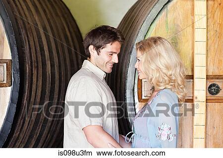 Picture - Happy couple in a winery. Fotosearch