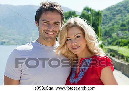 Stock Image - Happy couple outdoors. Fotosearch
