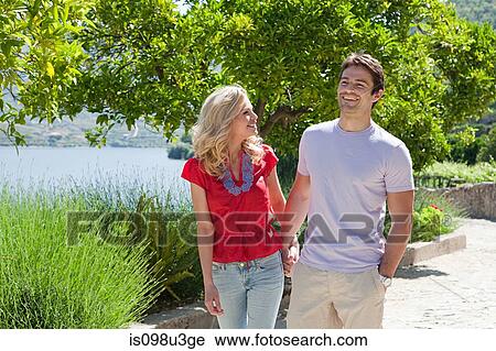 Happy couple outdoors View Large Photo Image Stock Image - Happy couple outdoors. Fotosearch