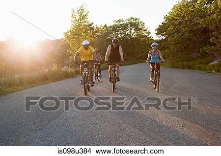 Four cyclists on the road View Large Photo Image Picture - Four cyclists on the road. Fotosearch