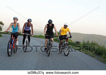 Four cyclists on the road View Large Photo Image Stock Photography - Four cyclists on the road. Fotosearch