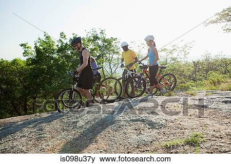 Four cyclists, rural scene View Large Photo Image Stock Photo - Four cyclists, rural scene. Fotosearch
