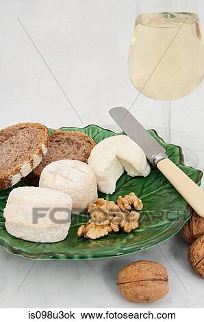 Goats cheese and walnuts with white wine View Large Photo Image Stock Image - Goats cheese and walnuts with white wine. Fotosearch