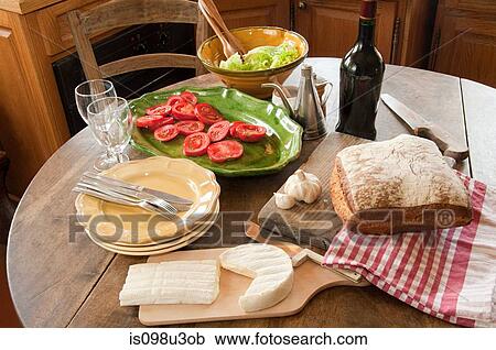 Stock Image - Table in french country kitchen. Fotosearch