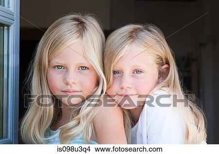 Blond twin girls, portrait View Large Photo Image Picture - Blond twin girls, portrait. Fotosearch
