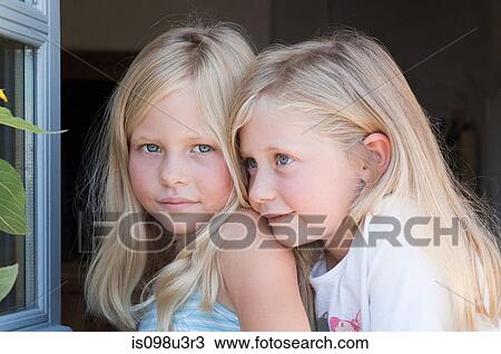 Blond twin girls, portrait View Large Photo Image Stock Image - Blond twin girls, portrait. Fotosearch