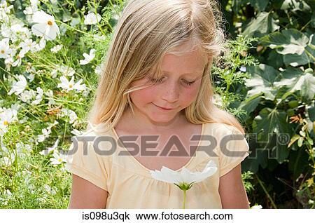 Girl holding flower View Large Photo Image Stock Image - Girl holding flower. Fotosearch