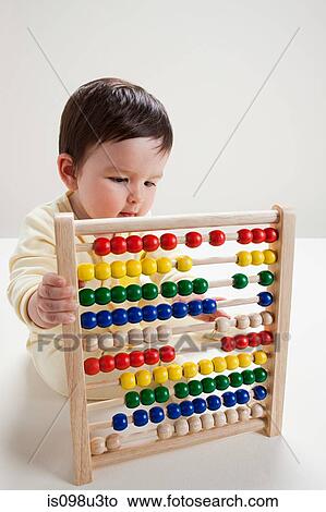 Baby boy playing with abacus View Large Photo Image Picture - Baby boy playing with abacus. Fotosearch