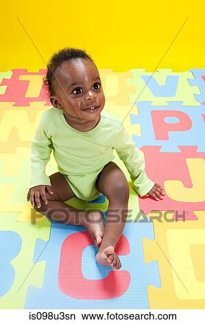 Baby boy playing with toy alphabet letters View Large Photo Image Picture - Baby boy playing with toy alphabet letters. Fotosearch