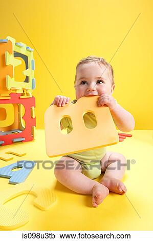 Baby boy playing with toy alphabet letters View Large Photo Image Stock Image - Baby boy playing with toy alphabet letters. Fotosearch