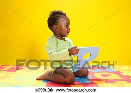 Baby boy playing with toy alphabet letters View Large Photo Image Stock Image - Baby boy playing with toy alphabet letters. Fotosearch