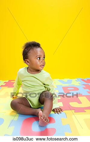 Baby boy playing with toy alphabet letters View Large Photo Image Stock Image - Baby boy playing with toy alphabet letters. Fotosearch
