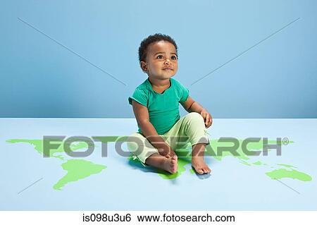 Baby boy sitting on world map on floor View Large Photo Image Stock Photograph - Baby boy sitting on world map on floor. Fotosearch