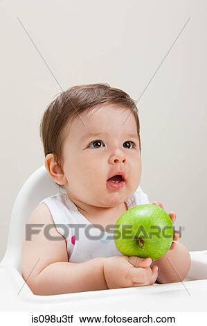 Baby boy with apple View Large Photo Image Stock Image - Baby boy with apple. Fotosearch