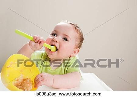 Baby boy with bowl of babyfood View Large Photo Image Stock Image - Baby boy with bowl of babyfood. Fotosearch