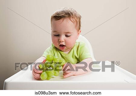 Baby boy with grapes View Large Photo Image Picture - Baby boy with grapes. Fotosearch