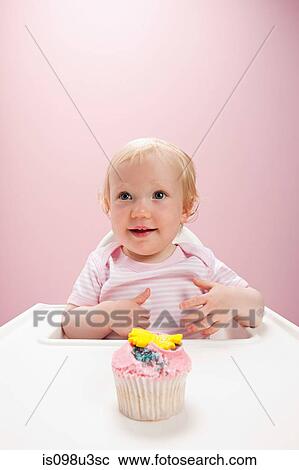 Baby girl with cupcake View Large Photo Image Stock Image - Baby girl with cupcake. Fotosearch