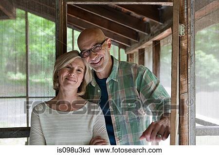 Mature couple at rural retreat View Large Photo Image Stock Image - Mature couple at rural retreat. Fotosearch