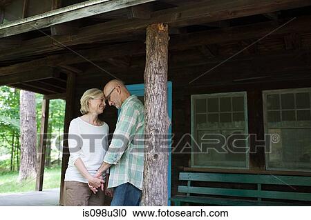 Mature couple at rural retreat View Large Photo Image Stock Image - Mature couple at rural retreat. Fotosearch