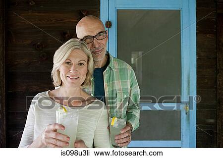 Stock Image - Mature couple at rural retreat. Fotosearch