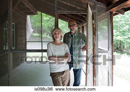 Stock Photograph - Mature couple at rural retreat. Fotosearch