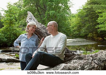 Picture - Mature couple outdoors in rural scene. Fotosearch