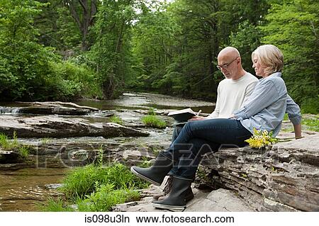 Picture - Mature couple outdoors in rural scene. Fotosearch